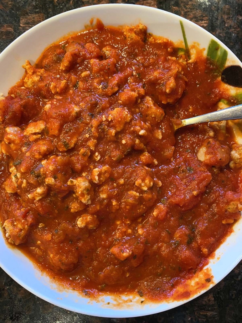 meat sauce in a bowl with spoon inside