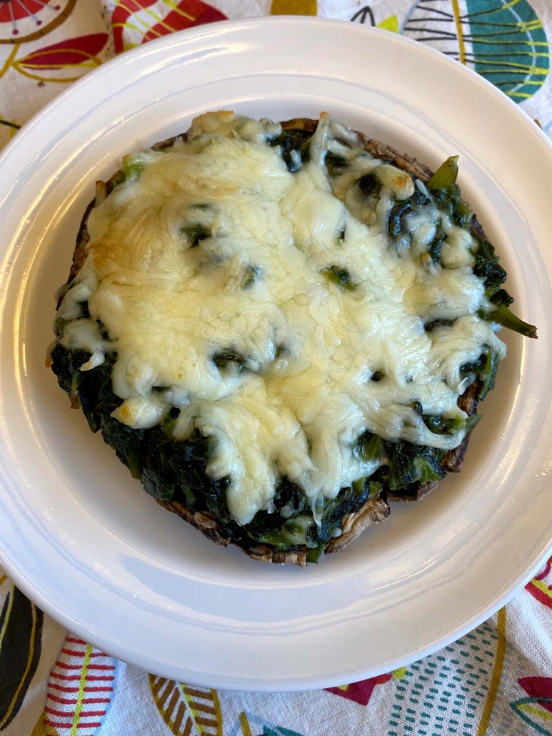 Spinach stuffed portobello mushroom baked with melted mozzarella cheese.