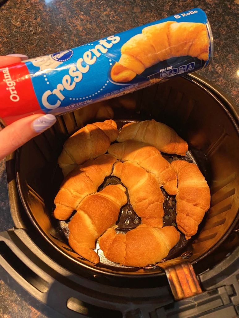 Pilsbury crescent rolls inside air fryer with packaging