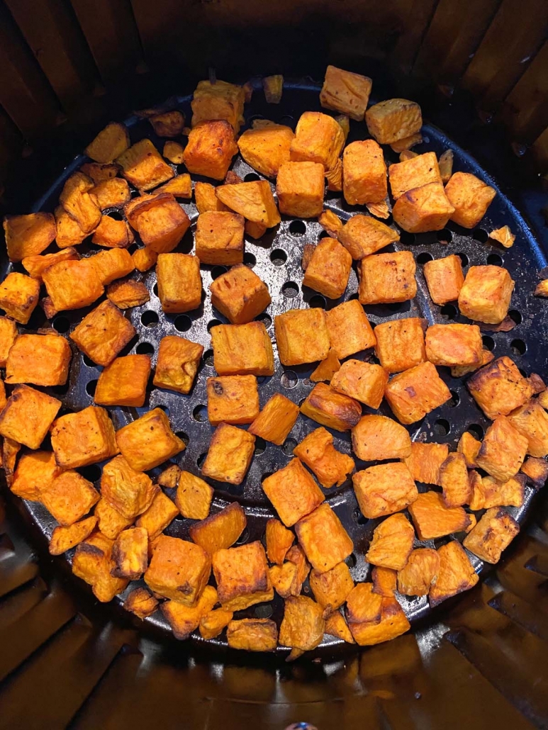 close up of sweet potatoes in air fryer