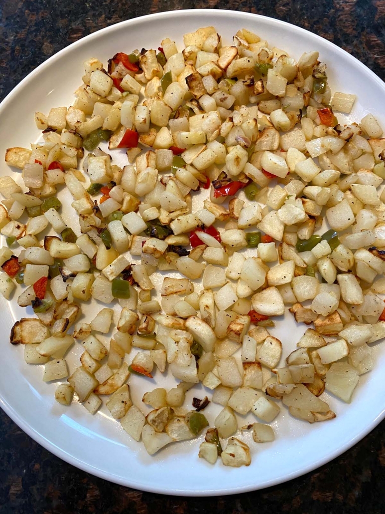 cooked diced potatoes o'brien on a plate
