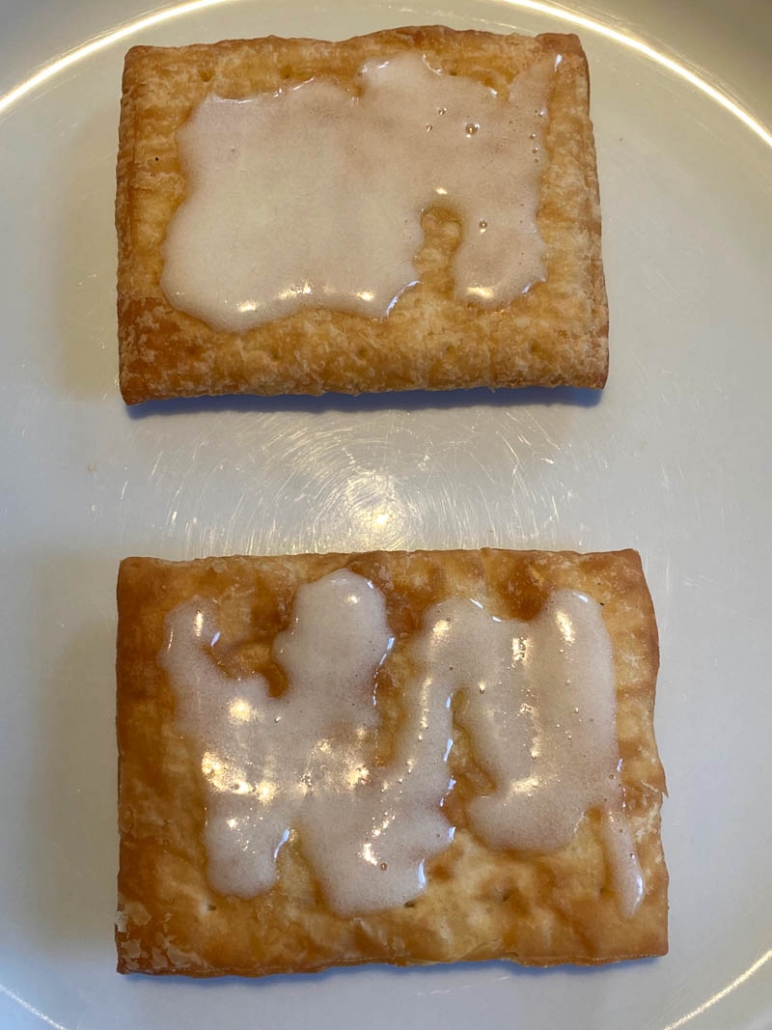 two toaster strudel on a plate with icing