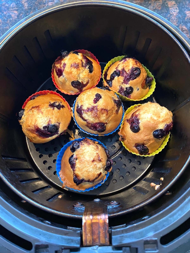 6 blueberry muffins cooking in the air fryer