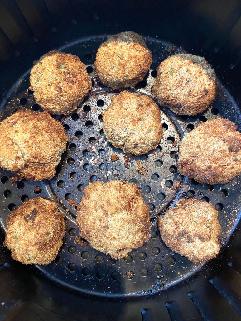 close up of breaded mushrooms in air fryer