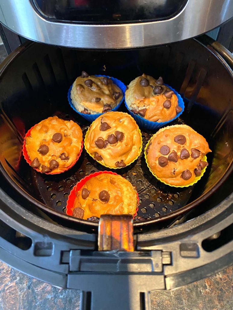 air fryer with chocolate chip muffins inside basket