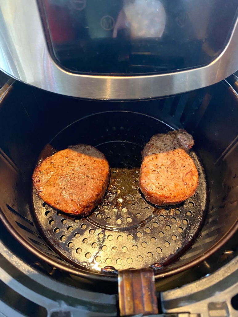 two filet mignon steaks in the air fryer