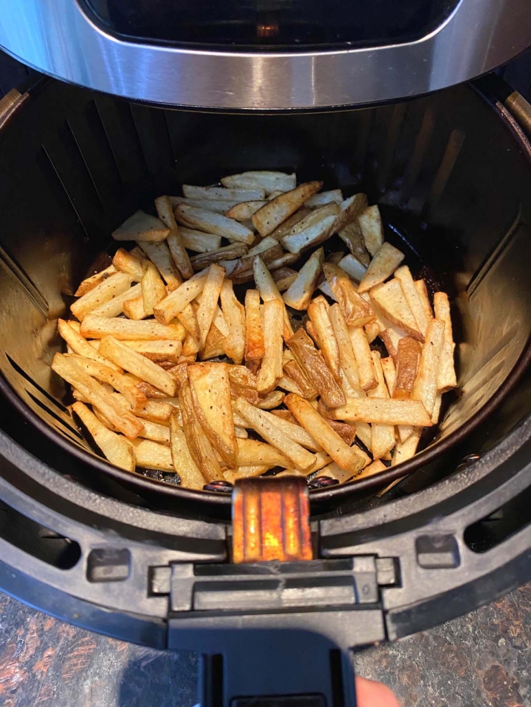 air fryer basket filled with homemade french fries