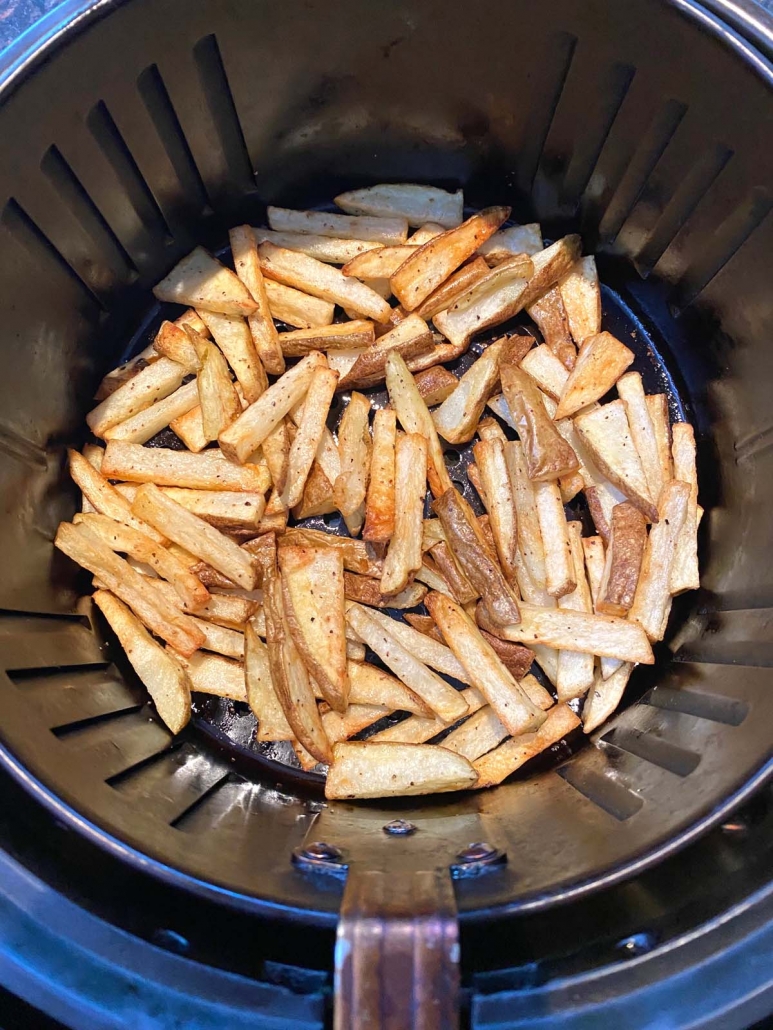air fryer basket filled with french fries