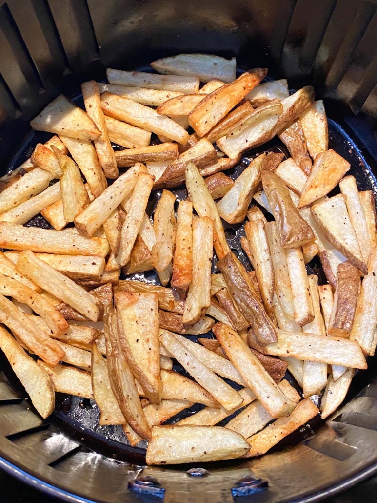 close up of french fries cooking in the air fryer