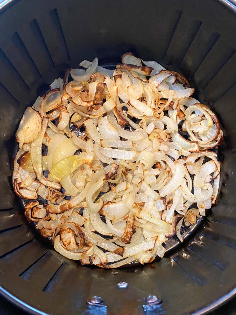 interior of air fryer basket with fried onions