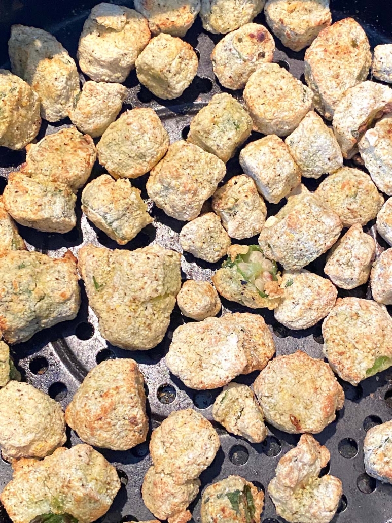 close up of frozen breaded okra pieces in the air fryer