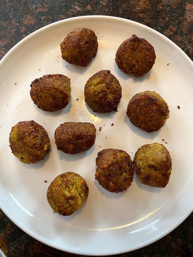 cooked falafel on a white plate