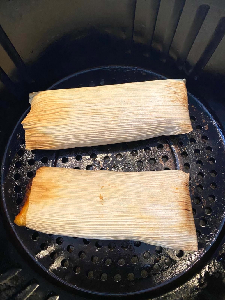 close up of beef tamales in the air fryer basket