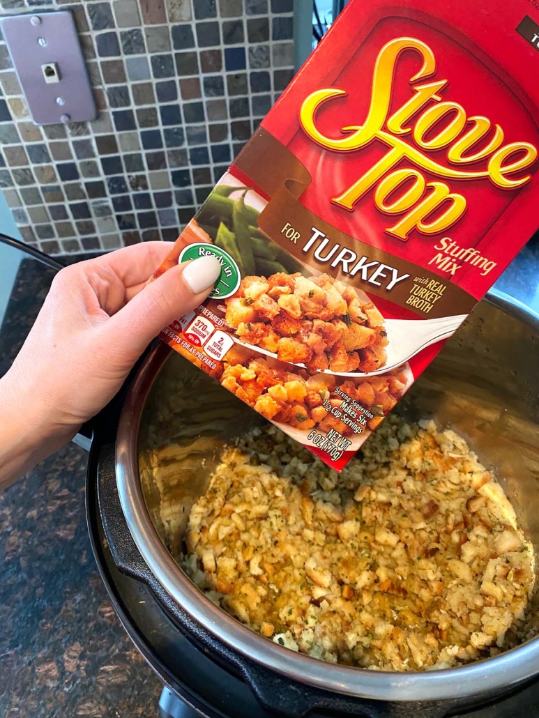 package of stove top turkey stuffing held over instant pot filled with stuffing