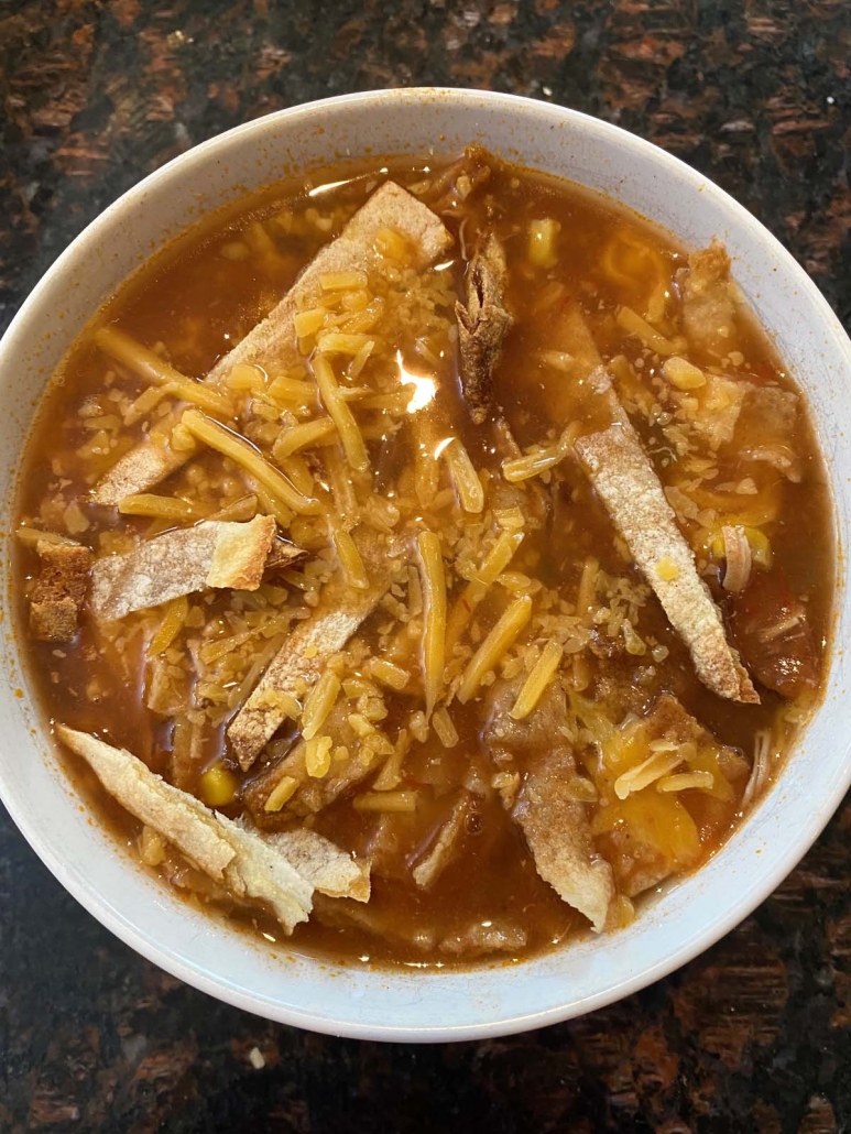 bowl filled with chicken tortilla soup cooked in instant pot