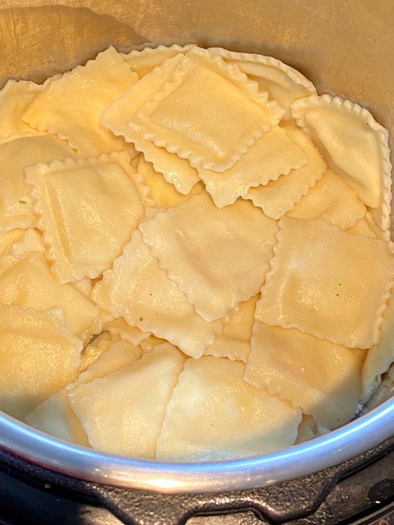 inside of instant pot filled with cooked ravioli