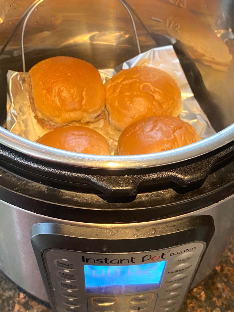 exterior and interior of instant pot with white castle sliders inside