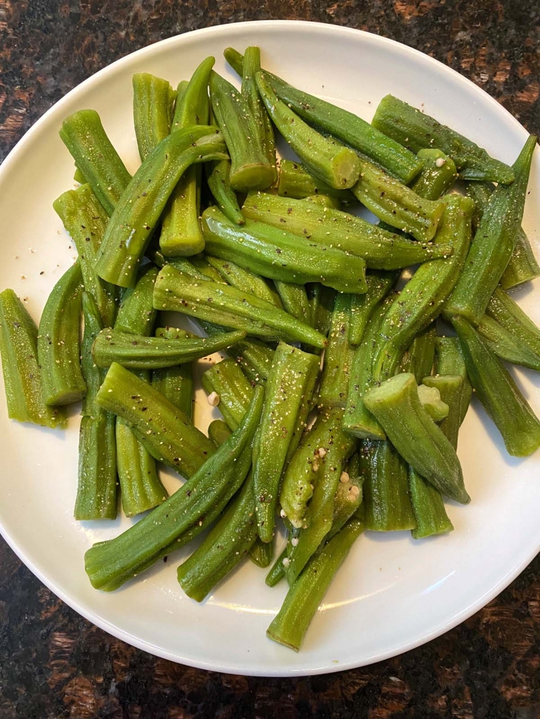 cooked okra on a white plate