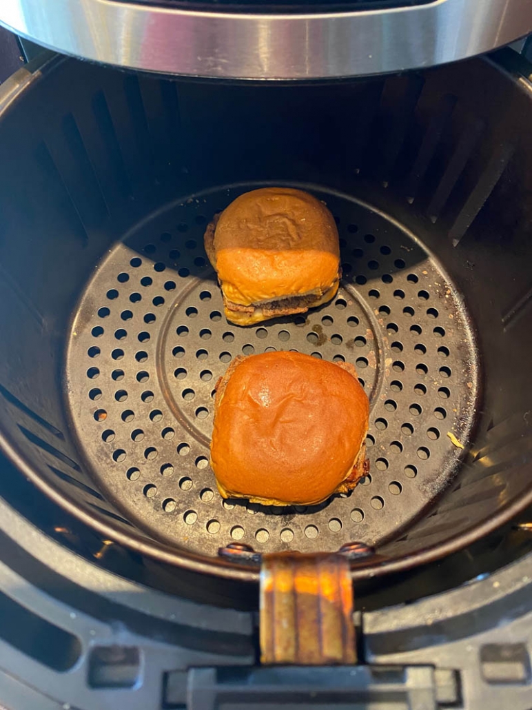 two white castle sliders inside the air fryer