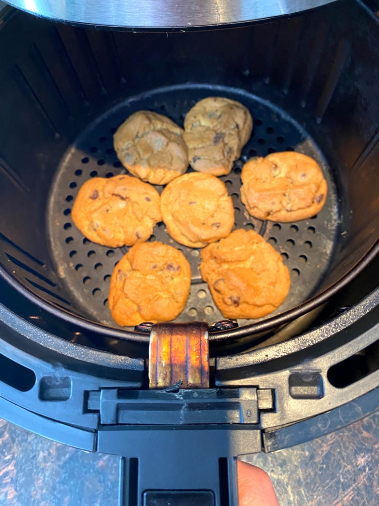 air fryer with chocolate chip cookies inside