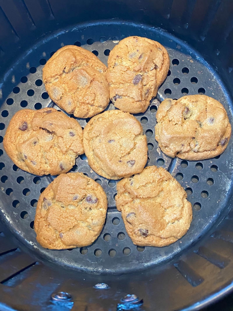 close up of pillsbury chooclate chip cookies in the air fryer