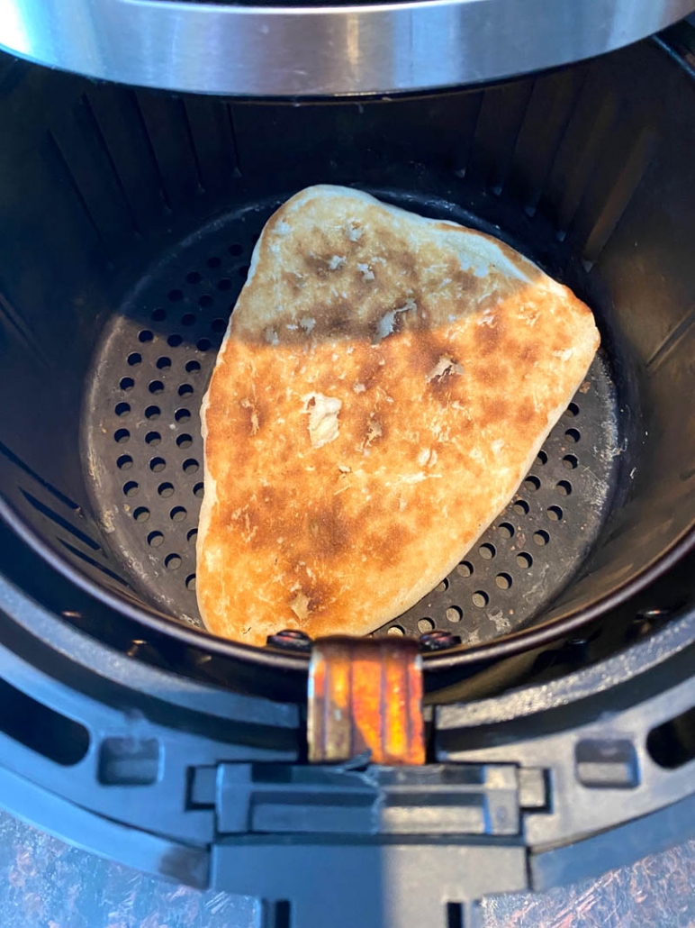 naan bread inside air fryer basket