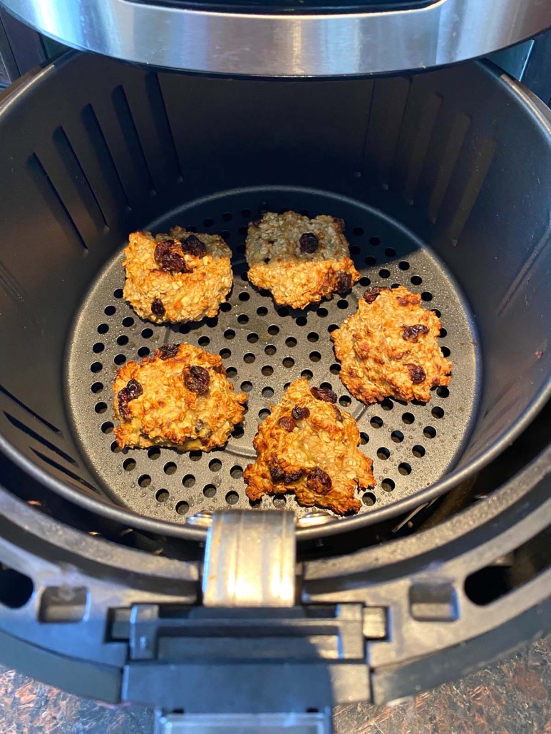 air fryer with banana oatmeal cookies inside