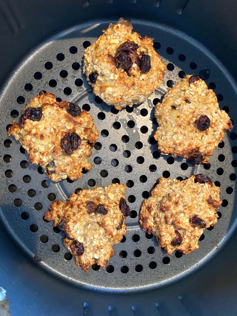 close up of banana oatmeal raisin cookies in the air fryer basket