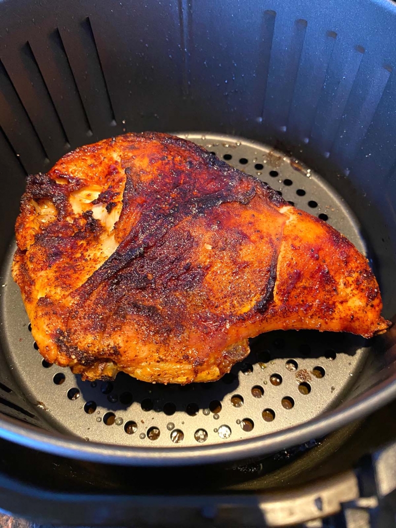 close up shot of bone-in chicken breast cooked in the air fryer