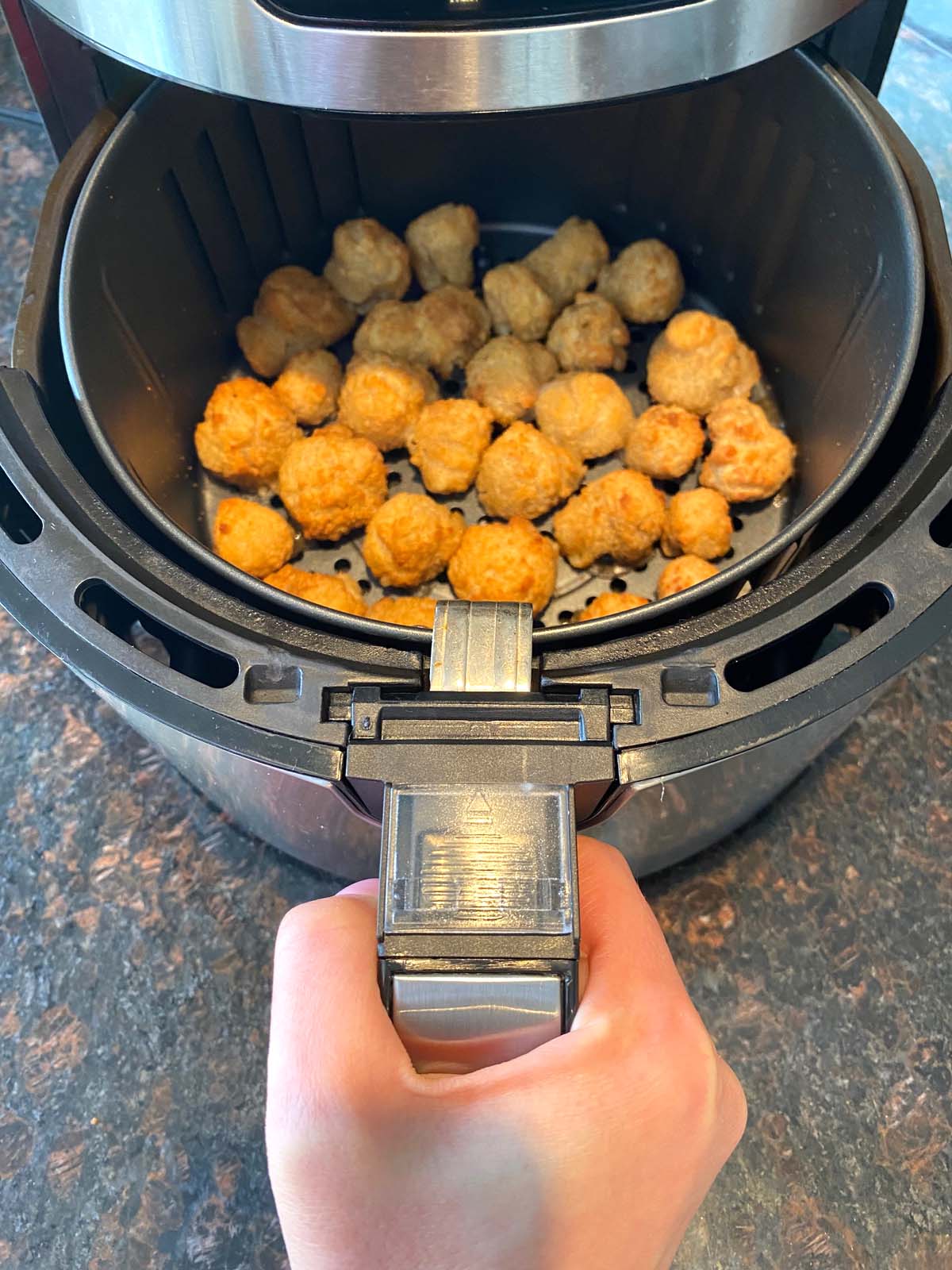 Cooked breaded mushrooms in the air fryer.