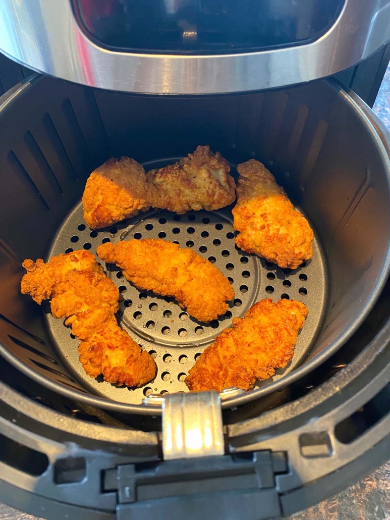 crispy frozen chicken strips cooked in the air fryer basket