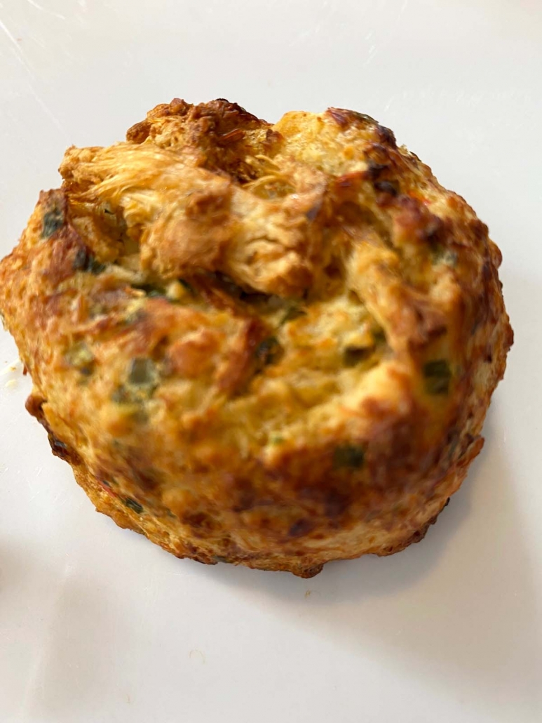 close up of individual air fried crab cake on a plate