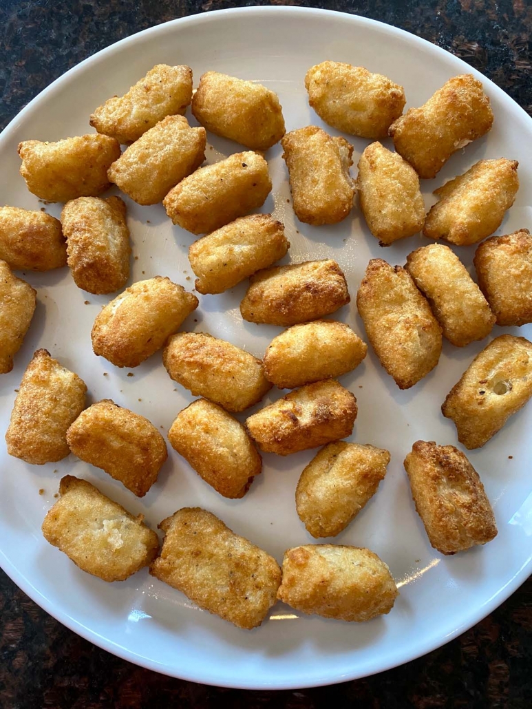 air fried veggie tots on a white plate