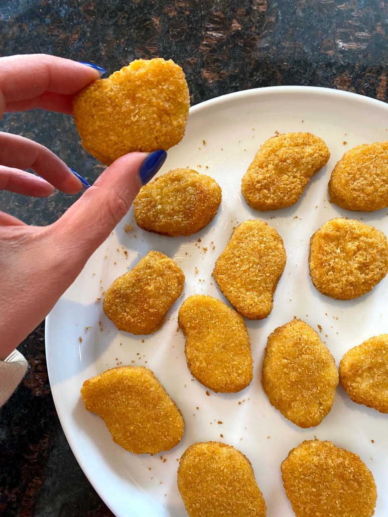 hand holding Impossible Chicken Nugget