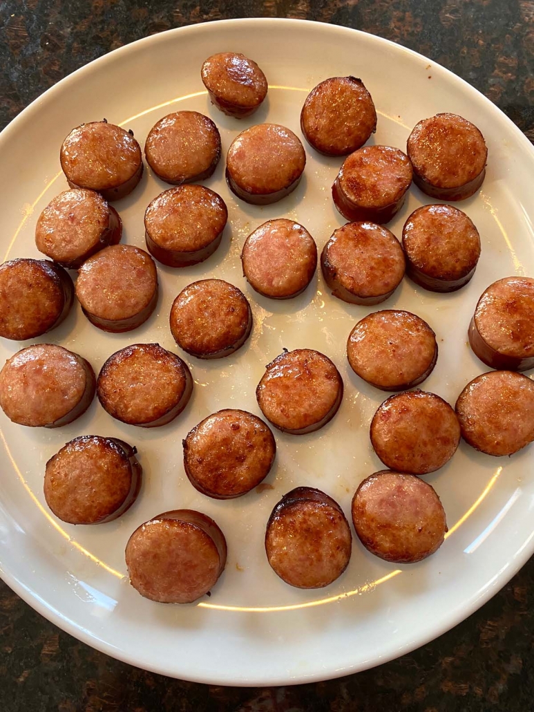 cooked kielbasa slices on a plate