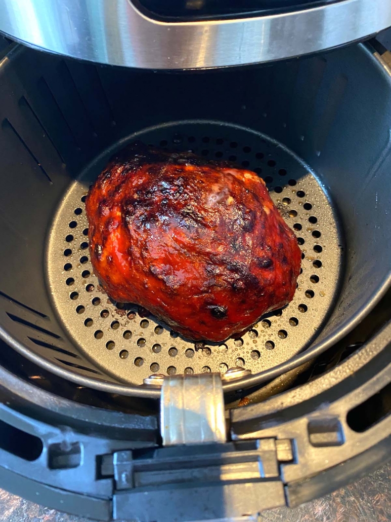 overhead shot of meatloaf in an air fryer basket