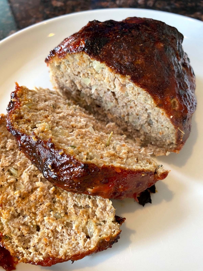 meatloaf cooked in air fryer served on a white plate