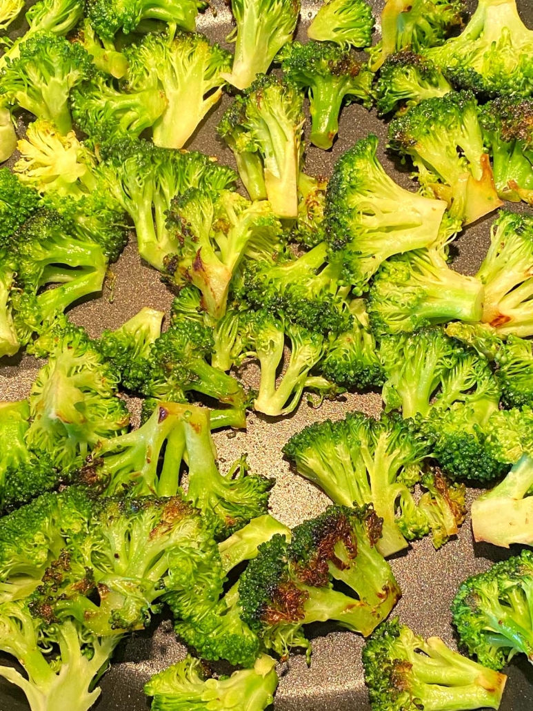 overhead photo of chopped broccoli sauteed in pan