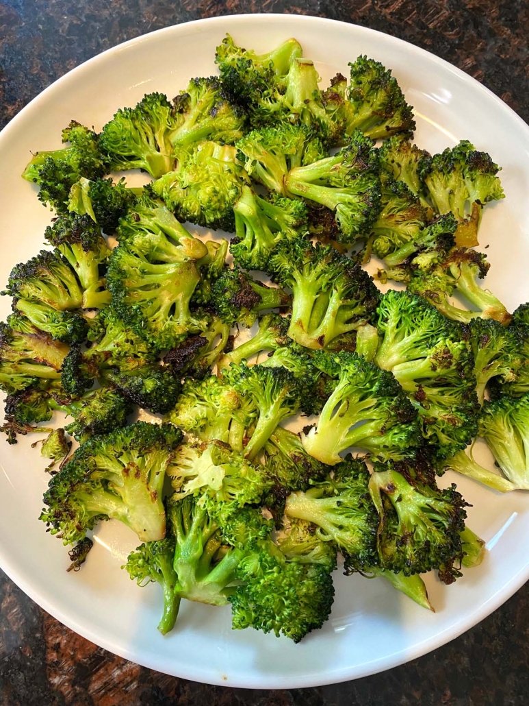 sauteed broccoli on a white plate