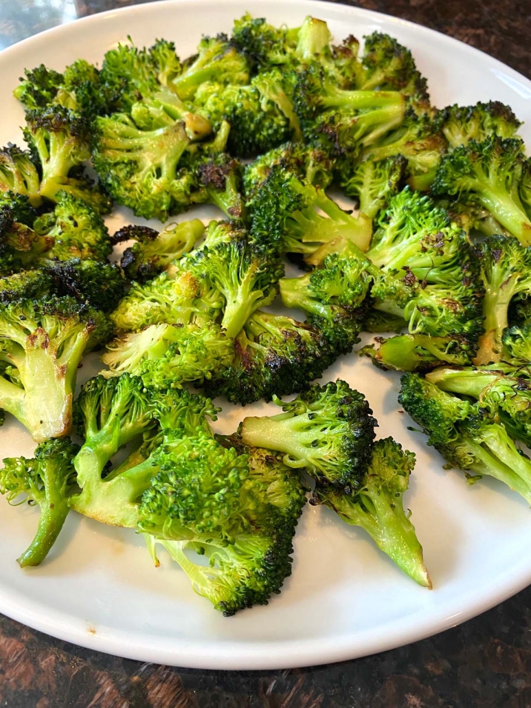 suateed broccoli on a white plate