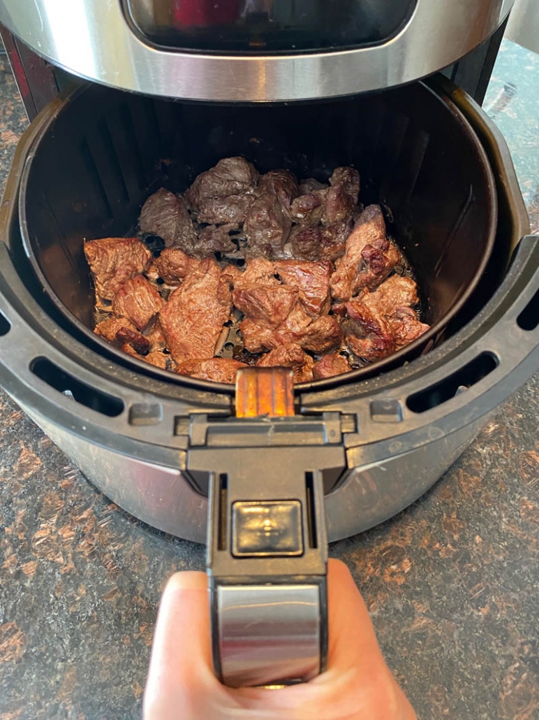 small pieces of steak cooking in the air fryer