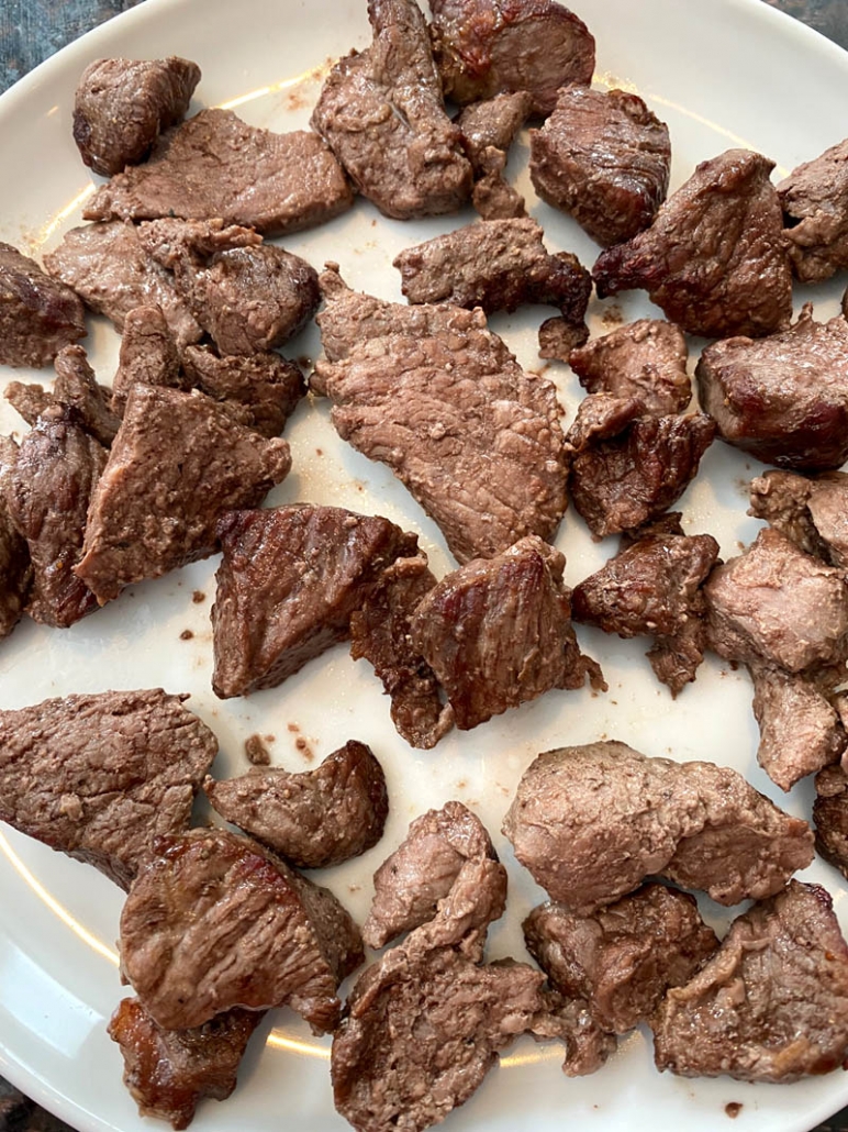 close up view of air fried steak bites on a plate