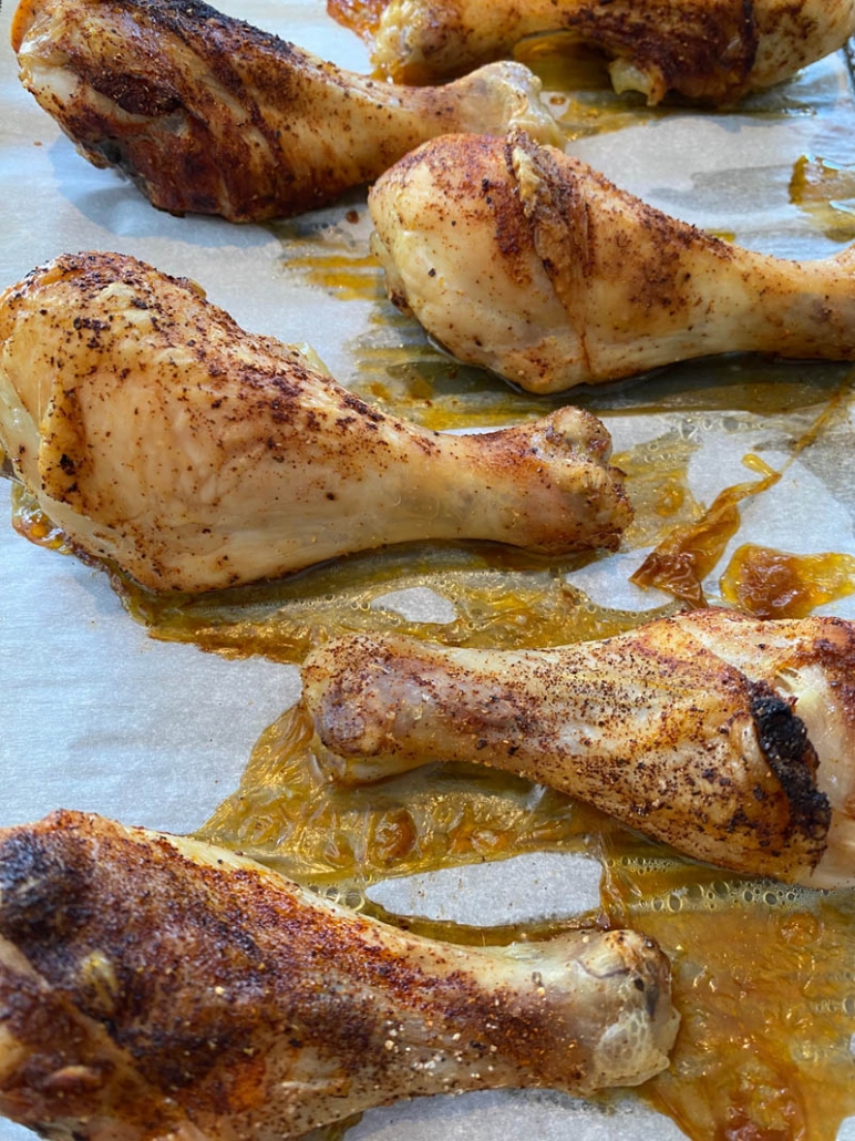 close up of oven baked chicken drumsticks