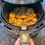 Cooked breaded zucchini in an air fryer.