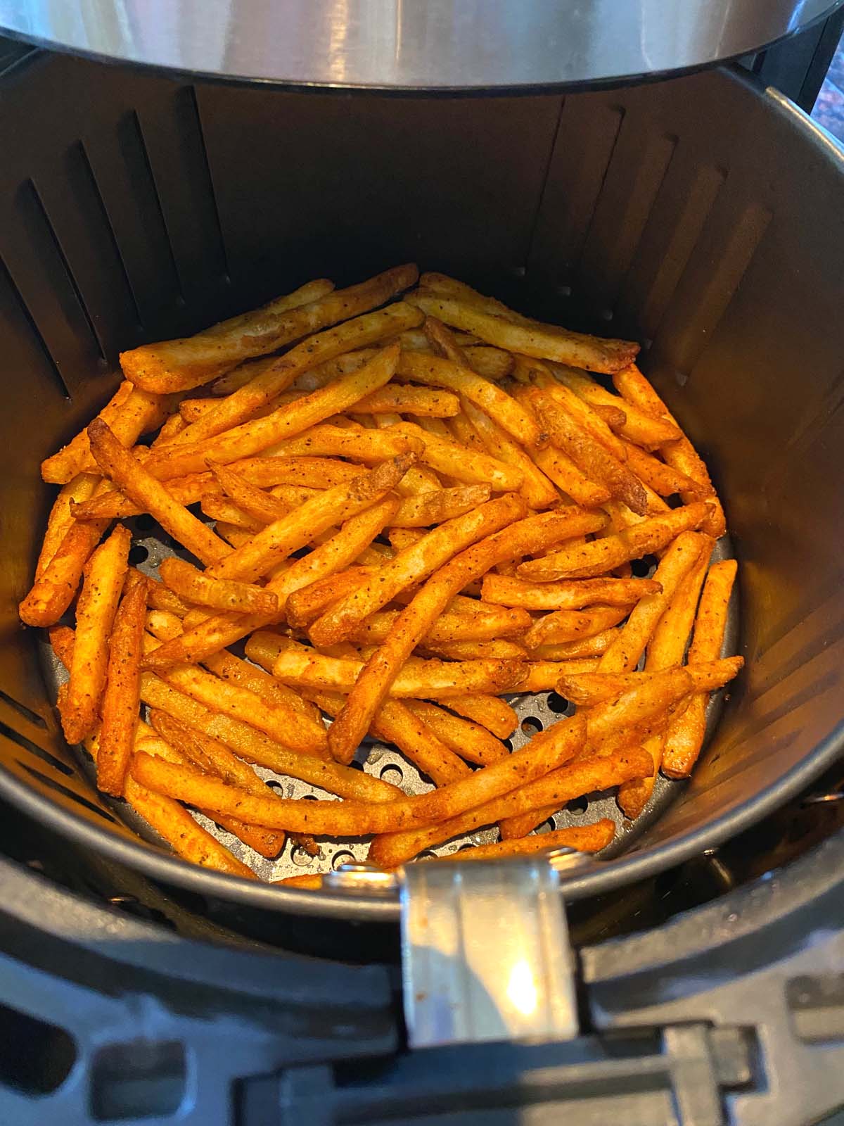 Cooked french fries in an air fryer.