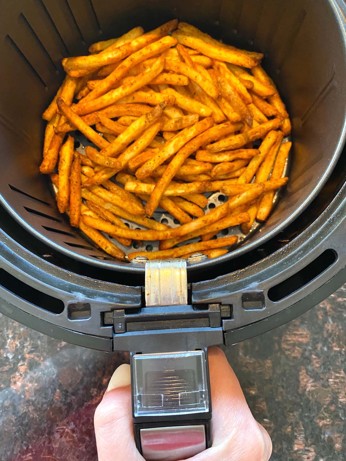 Cooked french fries in an air fryer.