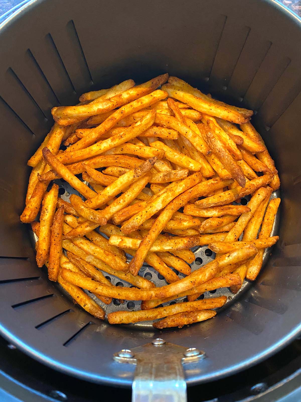 Cooked french fries in an air fryer.