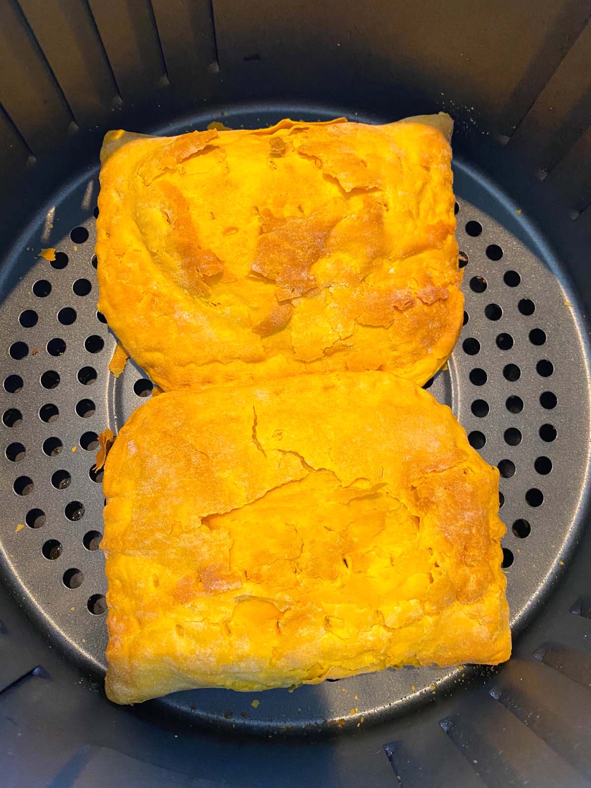 Cooked Jamaican beef patties in an air fryer.