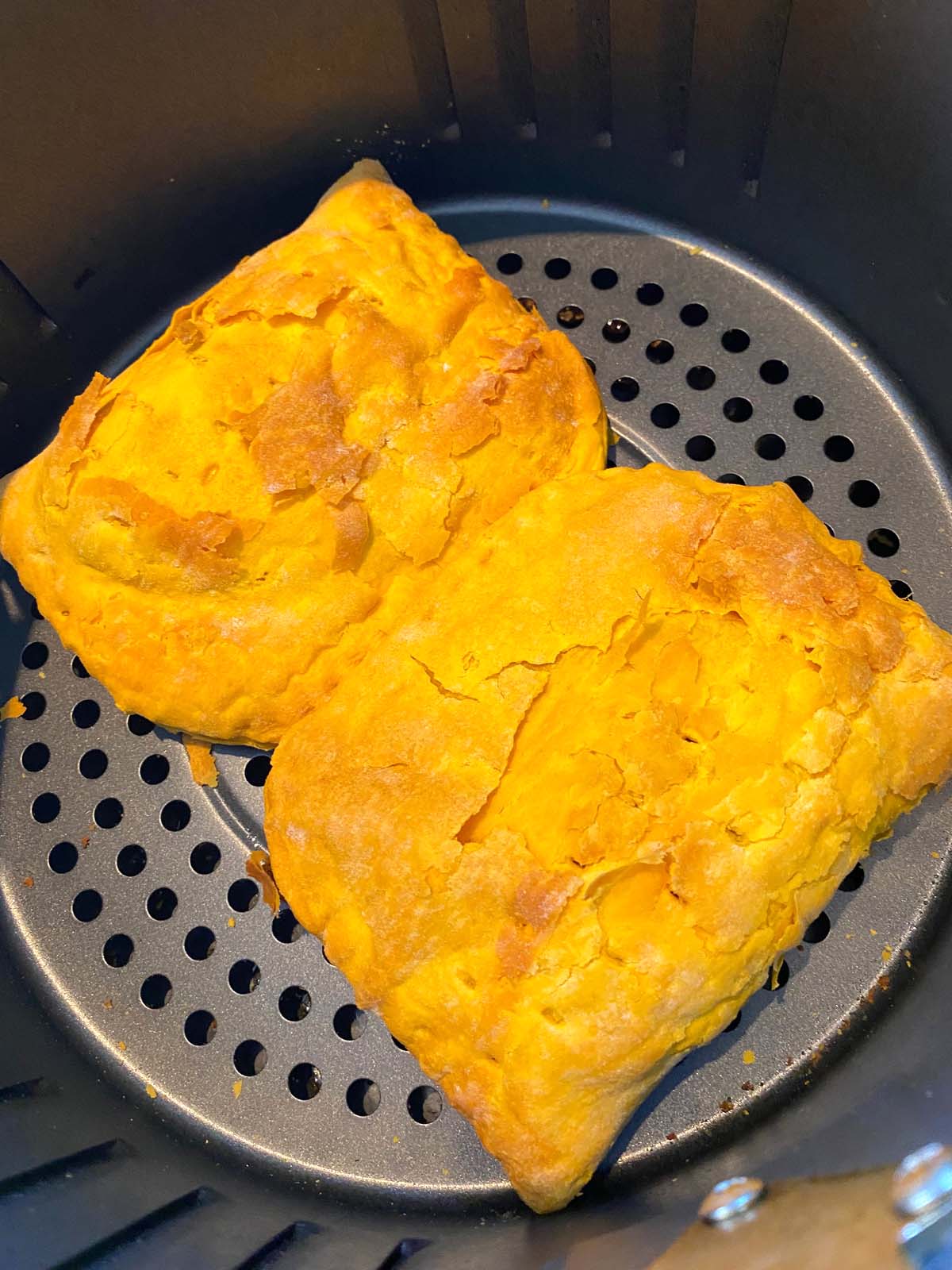 Cooked Jamaican beef patties in an air fryer.