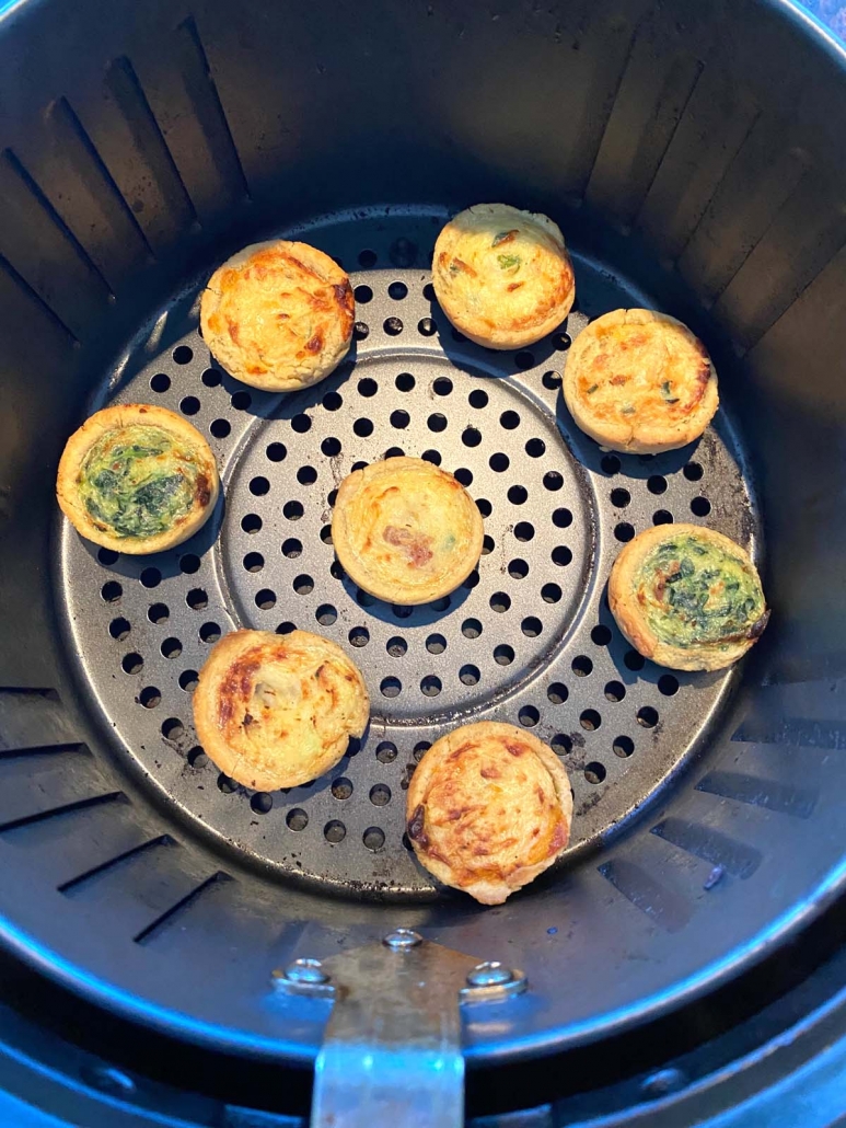 overhead view of mini quiches cooking in the air fryer